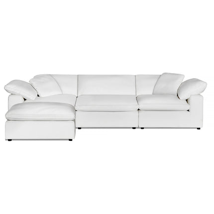 The Peyton 3 Piece Straight + Ottoman features a modern design with a left-side chaise and plush cushions for exceptional comfort. Its smooth upholstery, sleek style, wide armrests, and low profile define luxury against a white backdrop.