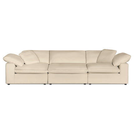 The Peyton 3 Piece Straight is a large, cream-colored leather sofa with three segments and plush, wide armrests. It exudes luxury with its minimalist design, perfectly balancing comfort and style against a plain white background.