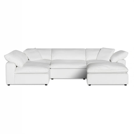 The Peyton 4 Piece + Ottoman is a cozy, large, white L-shaped sectional sofa with padded cushions and armrests. Its modern, minimalist design features clean lines and adapts to any space. Upholstered in smooth fabric, it rests on small black legs.