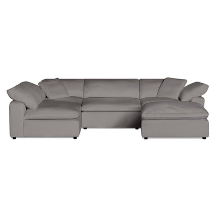 The Peyton 4 Piece + Ottoman, featuring an L-shaped design and gray cushions, offers balance and coziness with deep seating and broad armrests. This modern sectional seamlessly adapts to any space against a white backdrop.