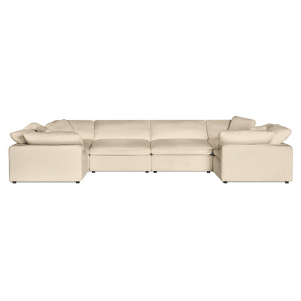 The Peyton 6 Piece Pit is a beige sectional sofa with three linked seating units and wide armrests for exceptional comfort, featuring plush cushions and a modern design against a plain white background.