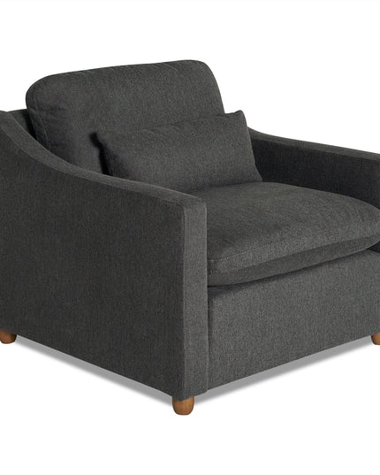 The My Cloud Slope Chair is a customizable dark gray armchair with a matching cushion. It features straight arms, wooden legs, and a modern design, offering a cozy and stylish seating option.