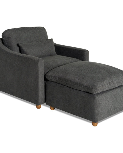 The My Cloud Slope Chair, featuring a dark gray finish, comes with an attached ottoman and wooden legs. Its high backrest and armrests provide comfort while adding a modern touch to any space.