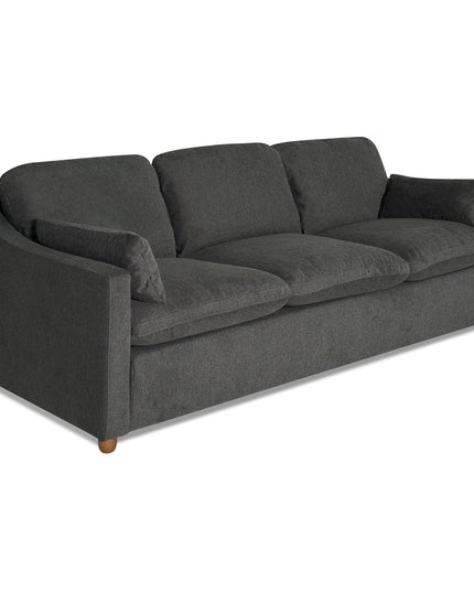 The My Cloud Slope Sofa is a dark gray, upholstered three-seater with plush removable cushions and wooden legs. It features a simple modern design with sloped arms for ultimate comfort, viewed from a slight angle. Customizable for your needs.