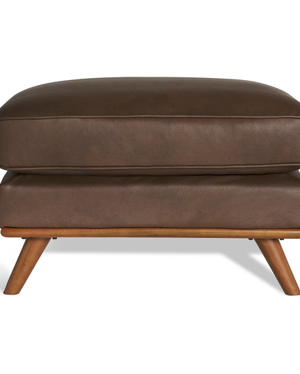 Meet the Maddox Ottoman—crafted in brown leather with a cushioned top and short, angled wooden legs. Its sleek rectangular form perfectly complements any living area, while its mid-century design adds subtle style.