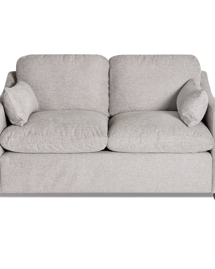 The My Cloud Slope Loveseat, part of the customizable collection, is a light gray upholstered piece with wooden legs. It features two cushions, armrests, and two small side pillows for a cozy look against a white background.