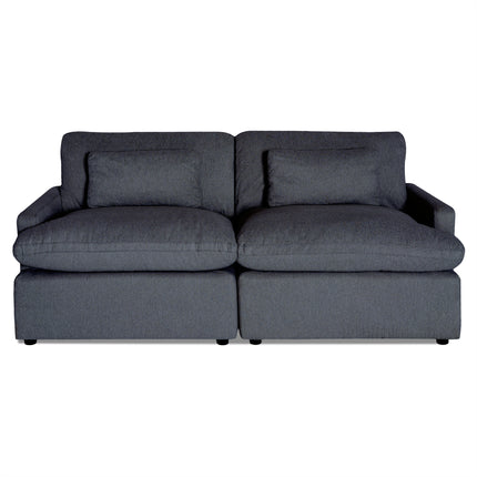 The My Cloud 2 Piece, a dark gray fabric sofa similar to the Worlds Greatest Sofa, offers two large seat and back cushions. Its minimalist design features slightly angled armrests, and the machine-washable fabric ensures easy maintenance.