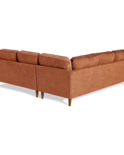 The Maddox Sectional is a brown L-shaped sofa with wooden legs, seen from the back. Featuring a clean mid-century modern design, it offers plush cushions and a textured fabric surface.