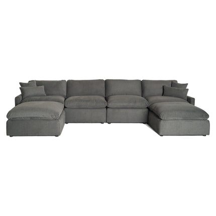 Introducing the My Cloud Slope: a modular gray sectional sofa with plush cushions, featuring two ottomans for additional comfort and versatility, set against a crisp white backdrop.