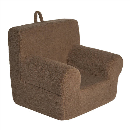 The My Cloud Kidz Chair is a plush, brown childrens armchair made from soft Sherpa fabric, featuring comfortable backrest and armrests. It has a top handle loop for easy carrying, ideal for customizable furniture collections.