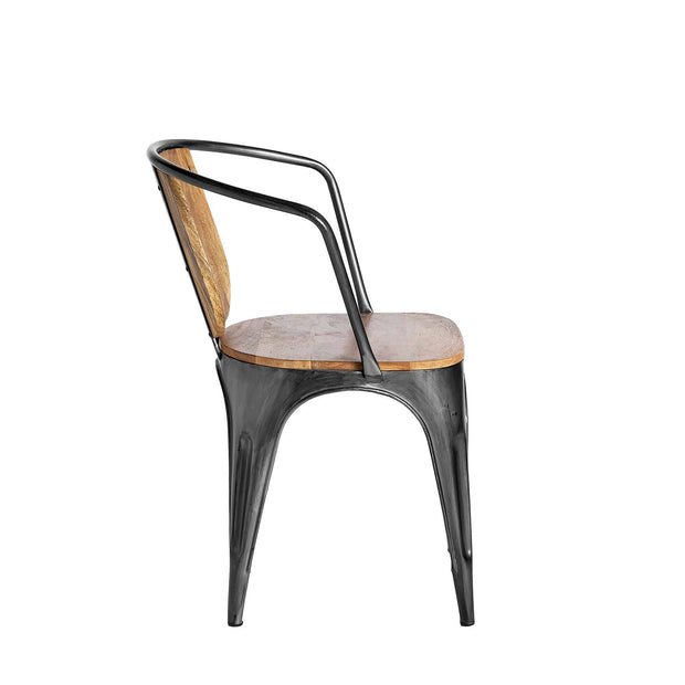 Side view of a Mango Barrel Chair, with a metal frame and sustainable mango wood seat and backrest. This industrial-style chair boasts a curved back support and integrated armrests, making it ideal for any dining set.