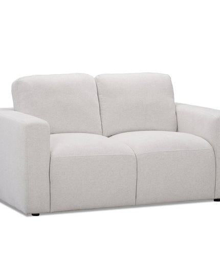 The Lugano Loveseat is a modern, light gray piece offering Italian luxury with plush cushions and wide armrests. Upholstered in soft fabric, its minimalist design is perfect for contemporary living spaces.