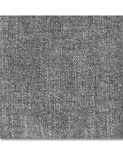 Close-up of a Free Fabric Swatch in gray, featuring a textured surface with subtle patterns and shading variations. The swatch appears soft yet slightly coarse and fills the frame against a white background.